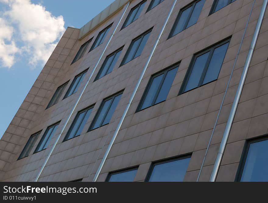 View of new modern office building and sky with clouds. View of new modern office building and sky with clouds