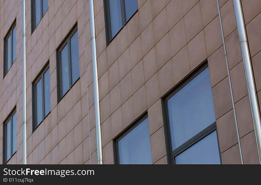 View of new modern office building slabbed with tiles. View of new modern office building slabbed with tiles