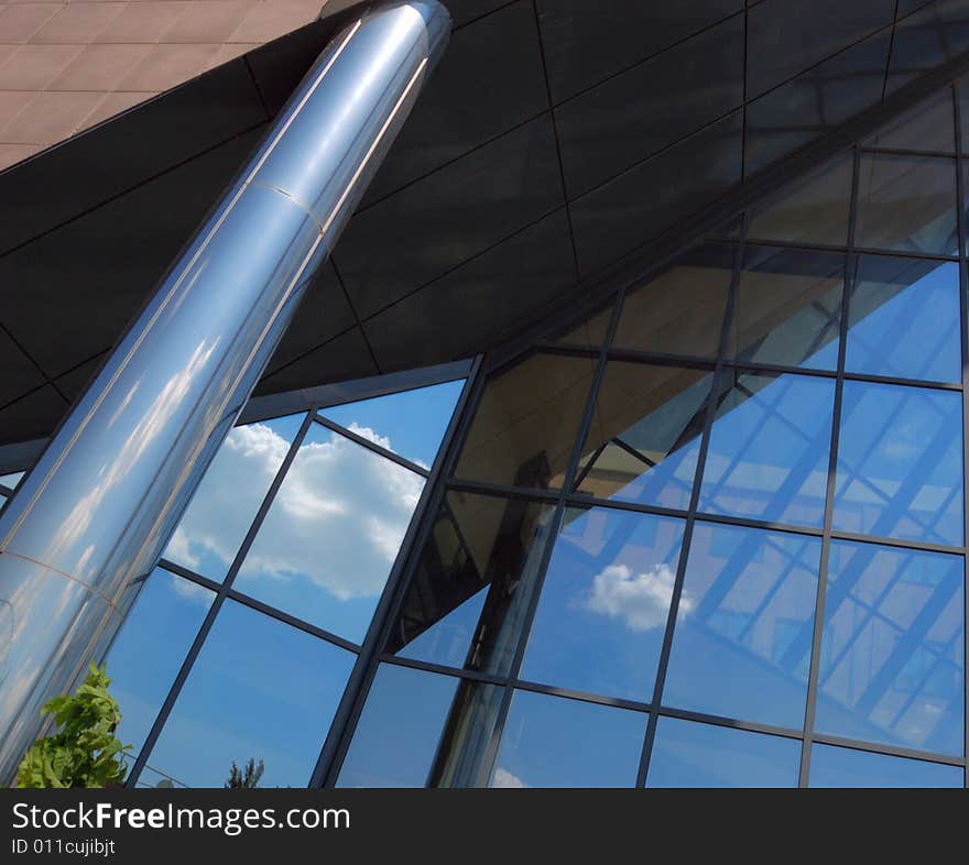 Front of new modern office building with reflections of clouds. Front of new modern office building with reflections of clouds