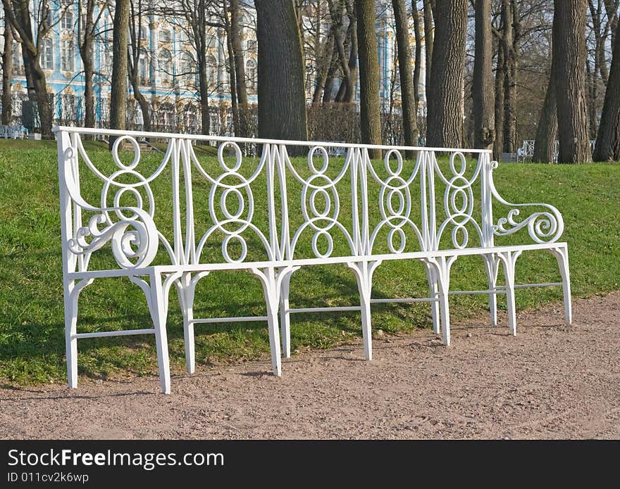 Laced metal bench in a park lane, town of Pushkin, Russia. Laced metal bench in a park lane, town of Pushkin, Russia