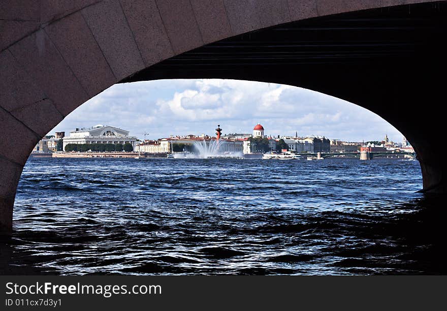 Floating fountain on Neva at the Arrow of island Vasilevski. A kind through arch  of the Troitski bridge. Floating fountain on Neva at the Arrow of island Vasilevski. A kind through arch  of the Troitski bridge