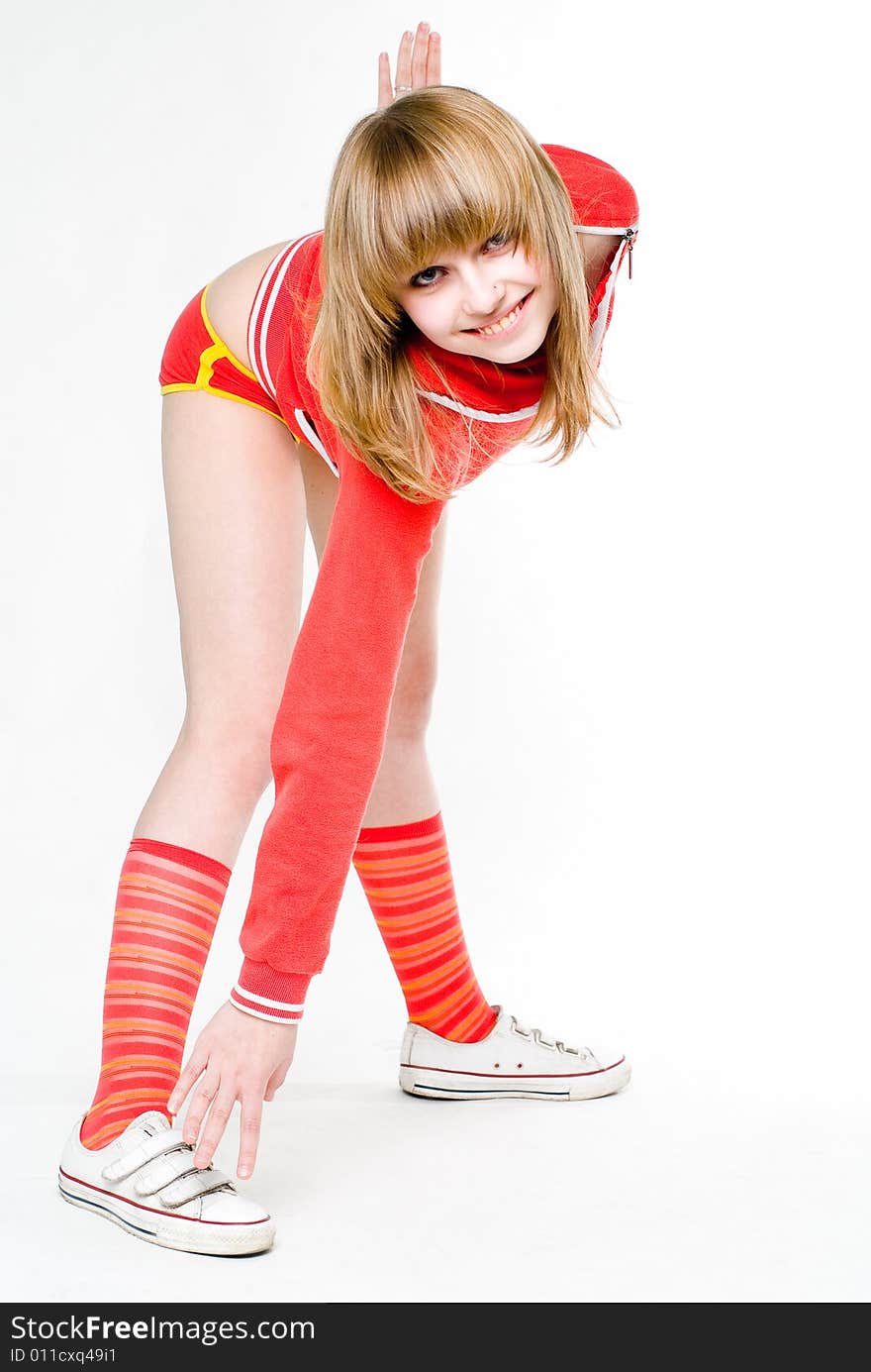 Young pretty model girl doing gymnastic exercises