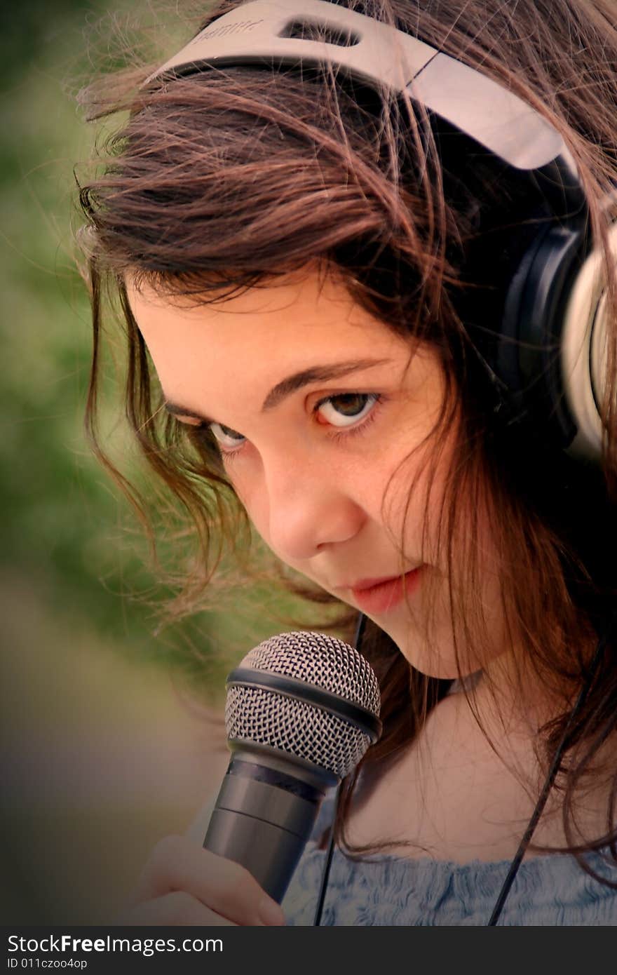 woman singing in microphone