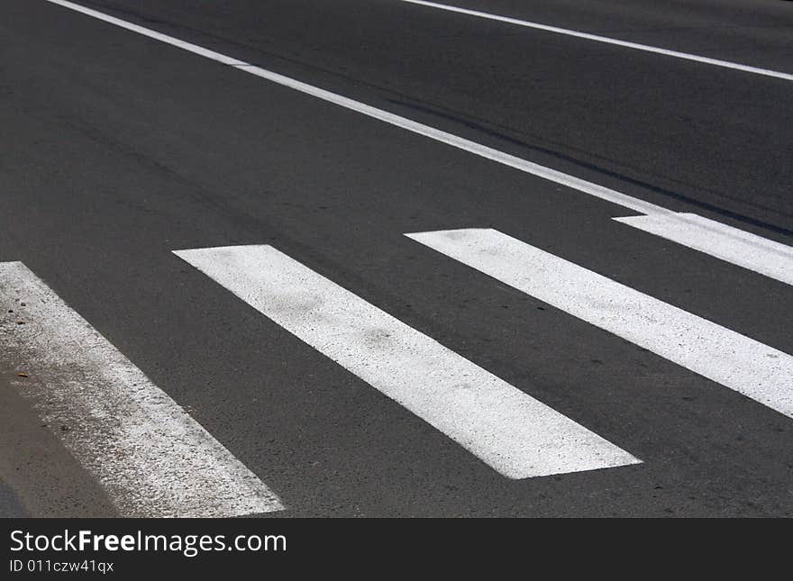 Pedestrian crossing on asphalt road