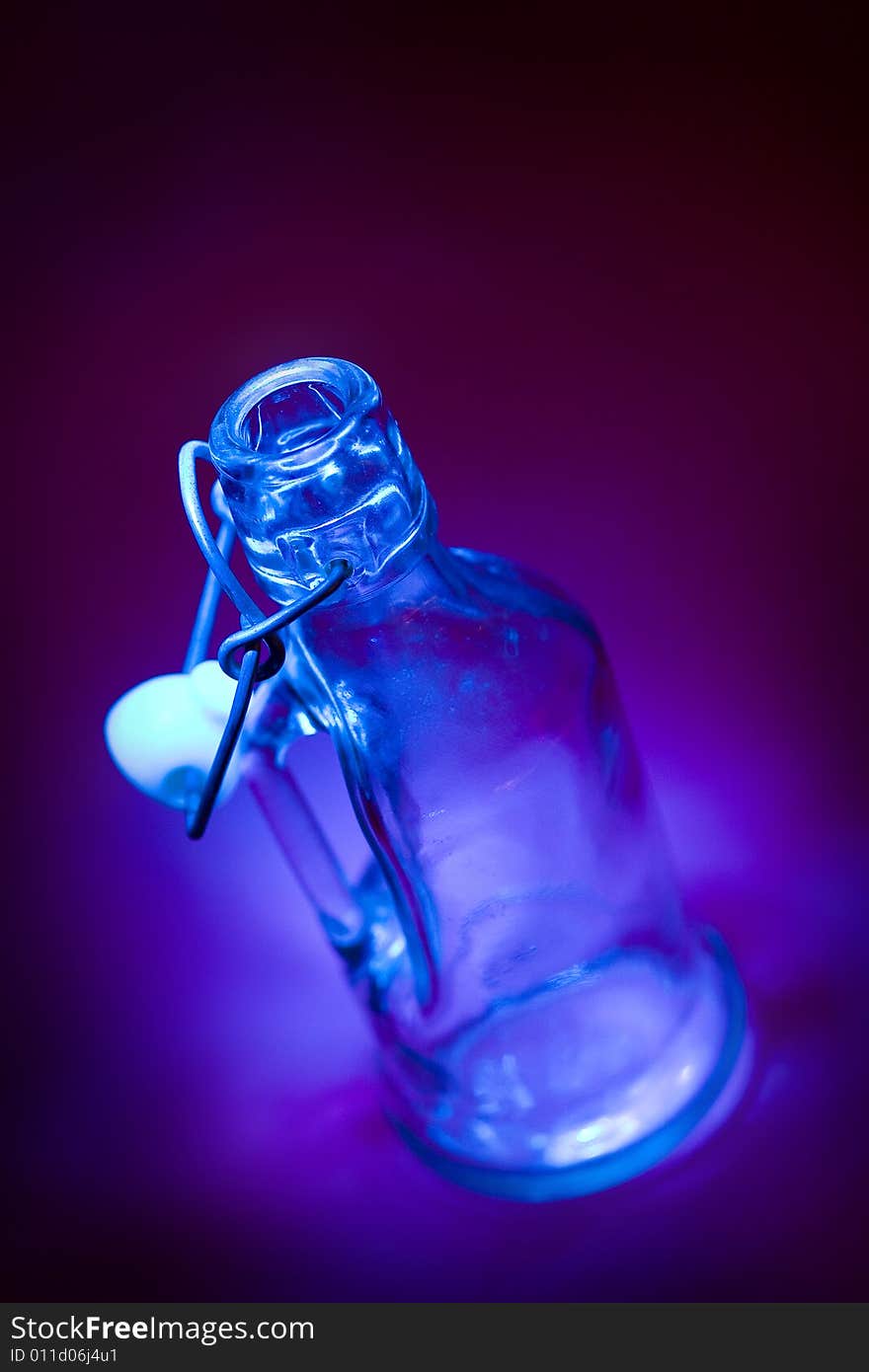 Abstract empty glass bottle photographed in an artistic way. Abstract empty glass bottle photographed in an artistic way