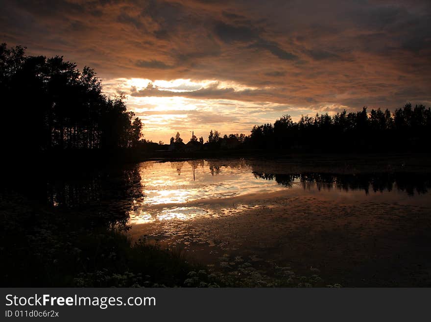 Lake at sunset with reflection in Finland