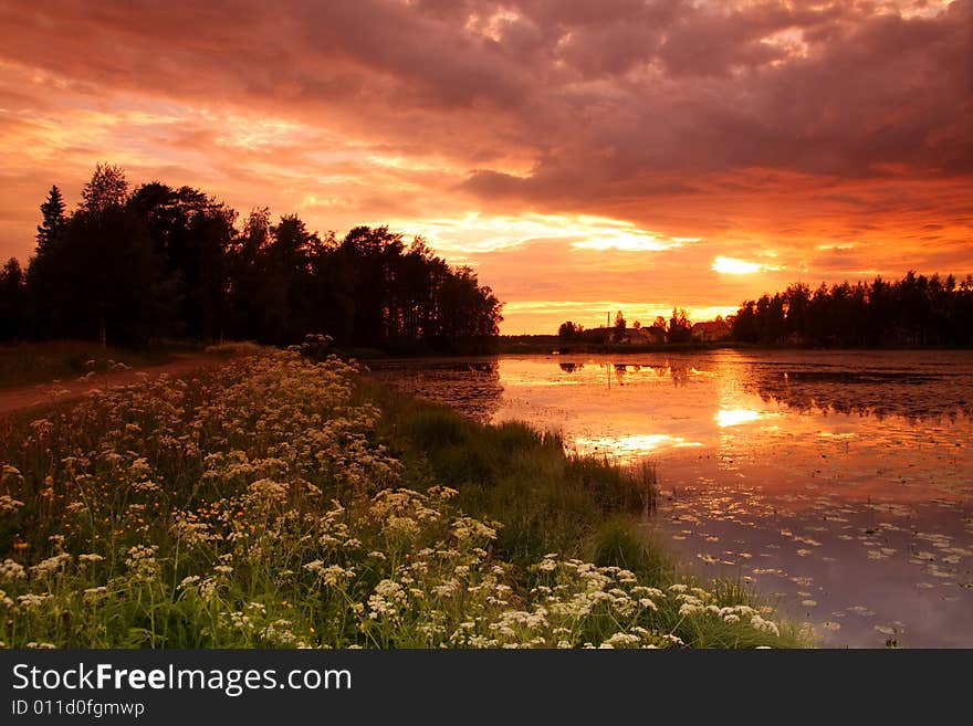 Lake at sunset with reflection in Finland