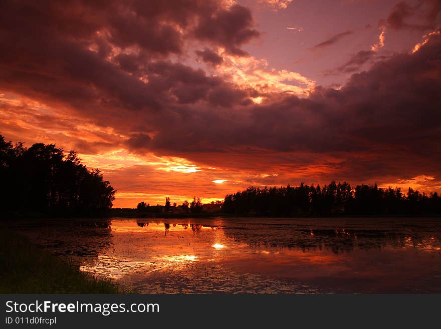 Lake at sunset with reflection in Finland