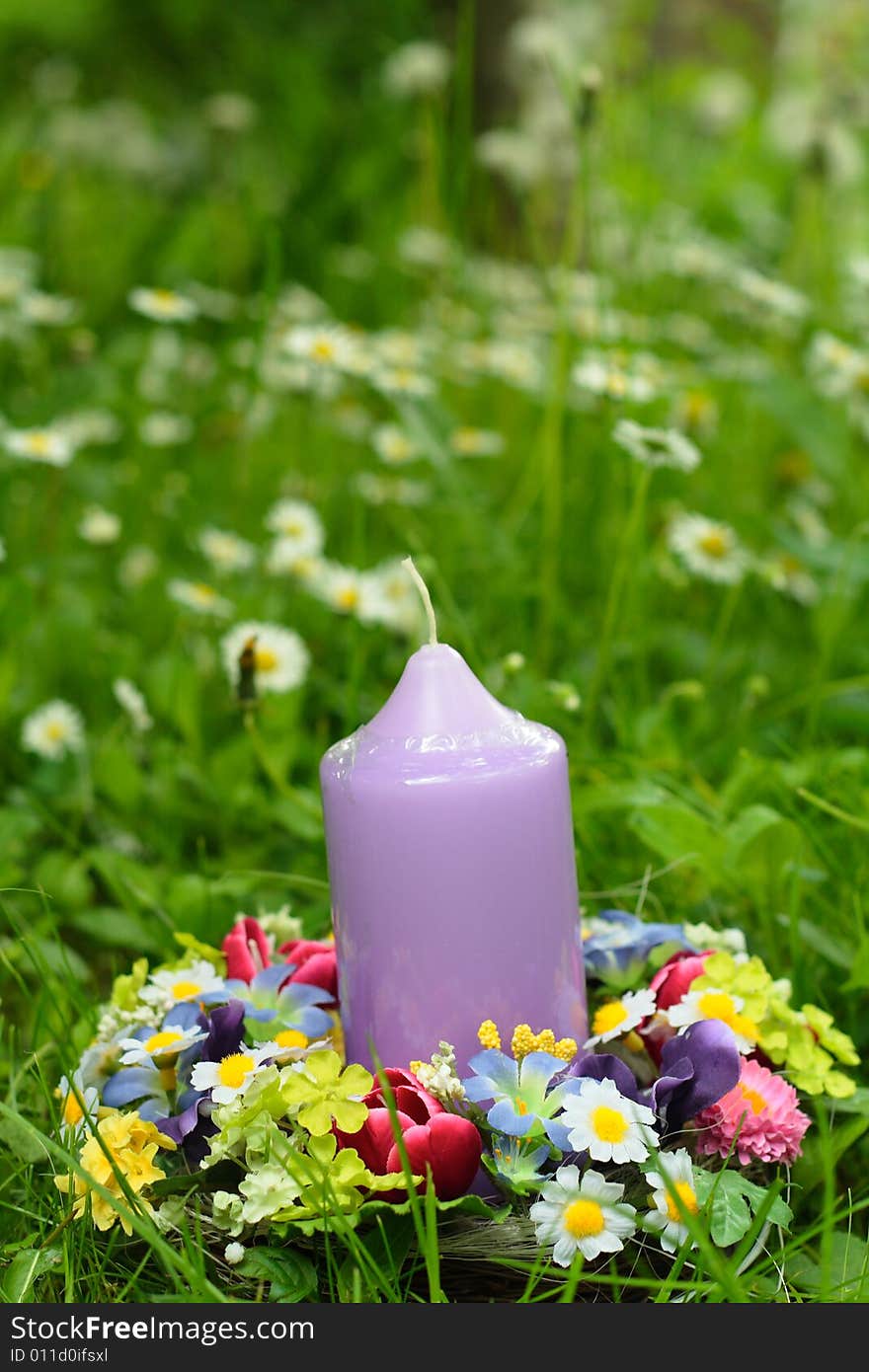 Easter decoration and candle in the garden