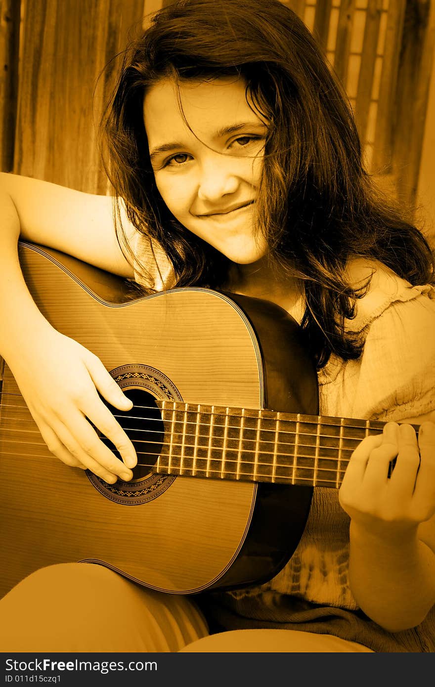 Girl Singing And Playing Guitar