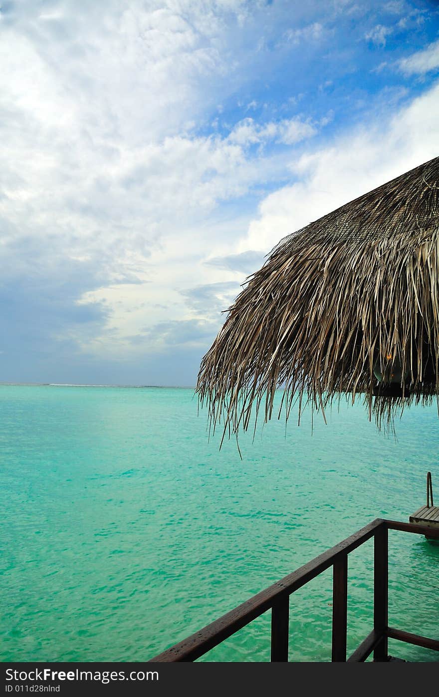 Island of Paradise. White sand beaches with coco-tree and crystal blue water. Maldives. Luxury holidays. Island of Paradise. White sand beaches with coco-tree and crystal blue water. Maldives. Luxury holidays.