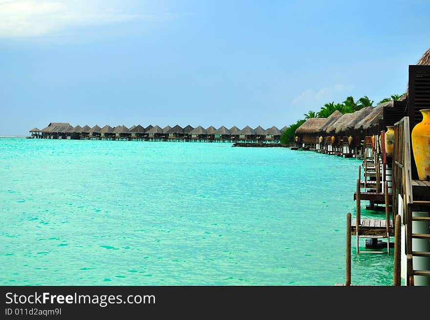 Island of Paradise. White sand beaches with coco-tree and crystal blue water. Maldives. Luxury holidays. Island of Paradise. White sand beaches with coco-tree and crystal blue water. Maldives. Luxury holidays.