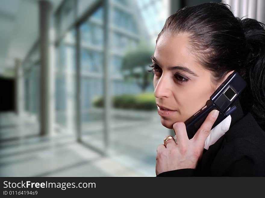 Pretty women ansering the phone at work. Pretty women ansering the phone at work