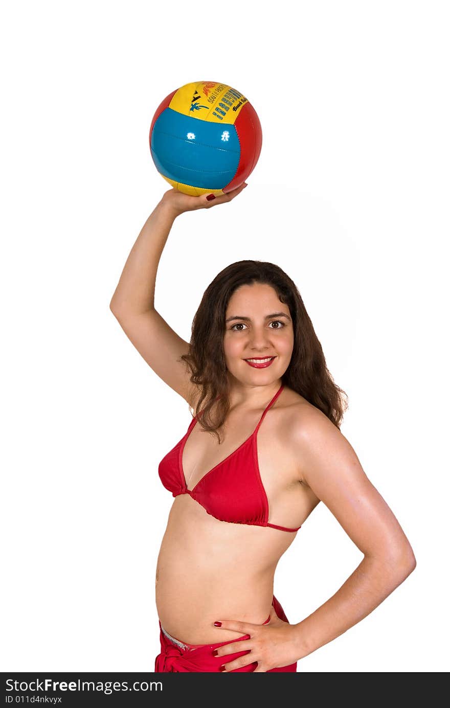 Beautiful girl, wearing red bikini, holding a beach volley ball above her head. Beautiful girl, wearing red bikini, holding a beach volley ball above her head