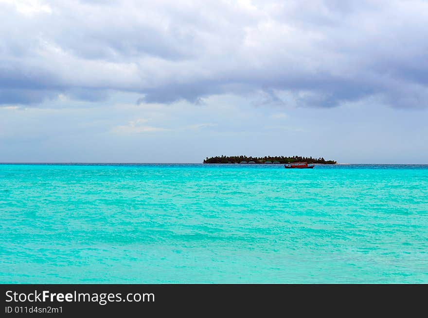 Island of Paradise. White sand beaches with coco-tree and crystal blue water. Maldives. Luxury holidays. Island of Paradise. White sand beaches with coco-tree and crystal blue water. Maldives. Luxury holidays.