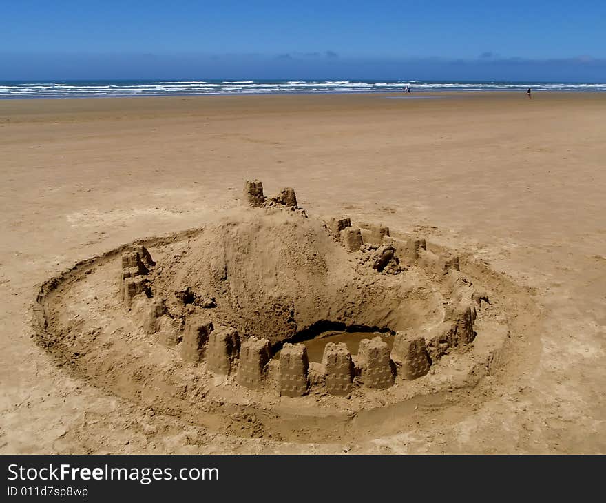 Sand castle on the sandy ocean beach. Sand castle on the sandy ocean beach