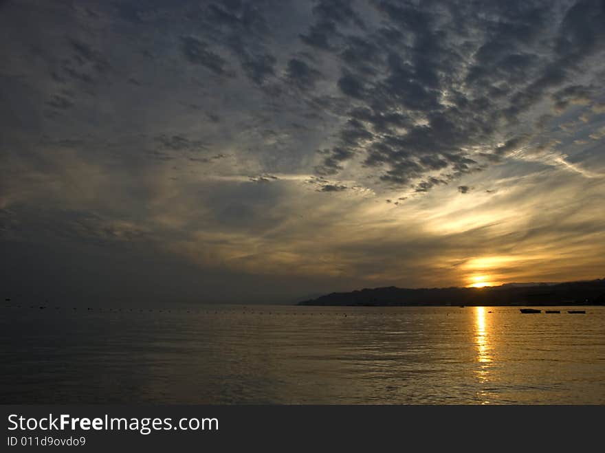 The shot was taken from the northern beach of Eilat - popular resort and recreation city in Israel, it is located on the Red Sea. The shot was taken from the northern beach of Eilat - popular resort and recreation city in Israel, it is located on the Red Sea