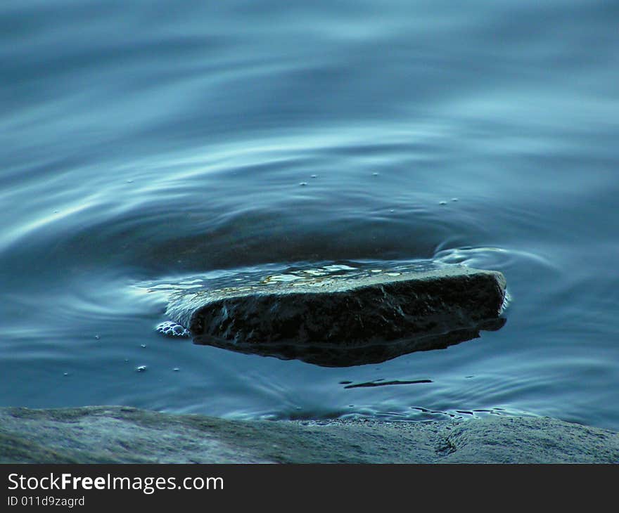 Rock Surrounded By Water