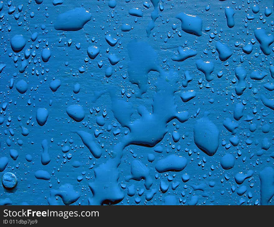 Water drops on blue surface.