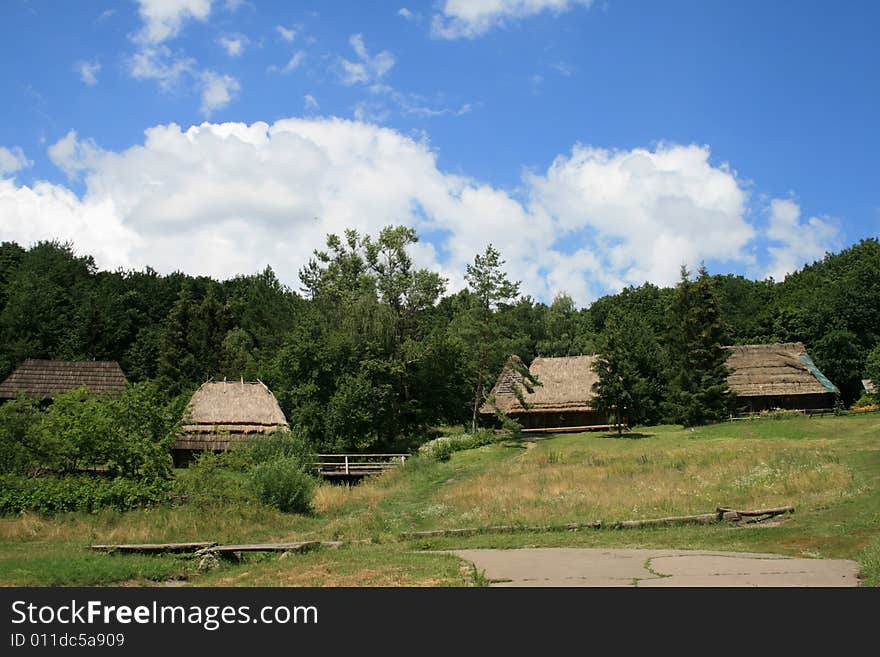 Some ancient houses worth on a hill in a wood. Some ancient houses worth on a hill in a wood