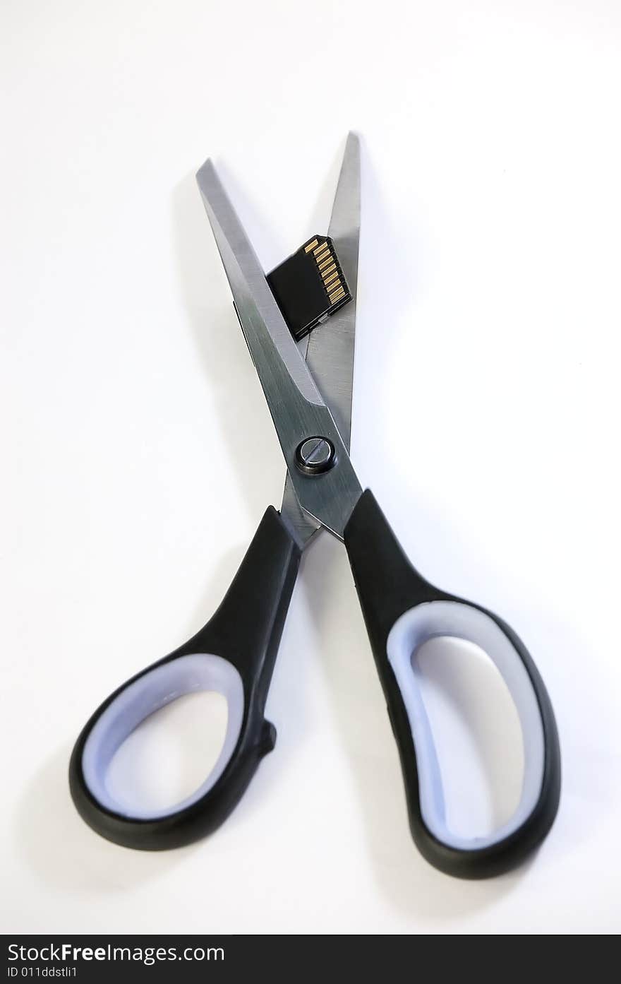 Scissors cuts usb flash memory, isolated on white backround. Scissors cuts usb flash memory, isolated on white backround