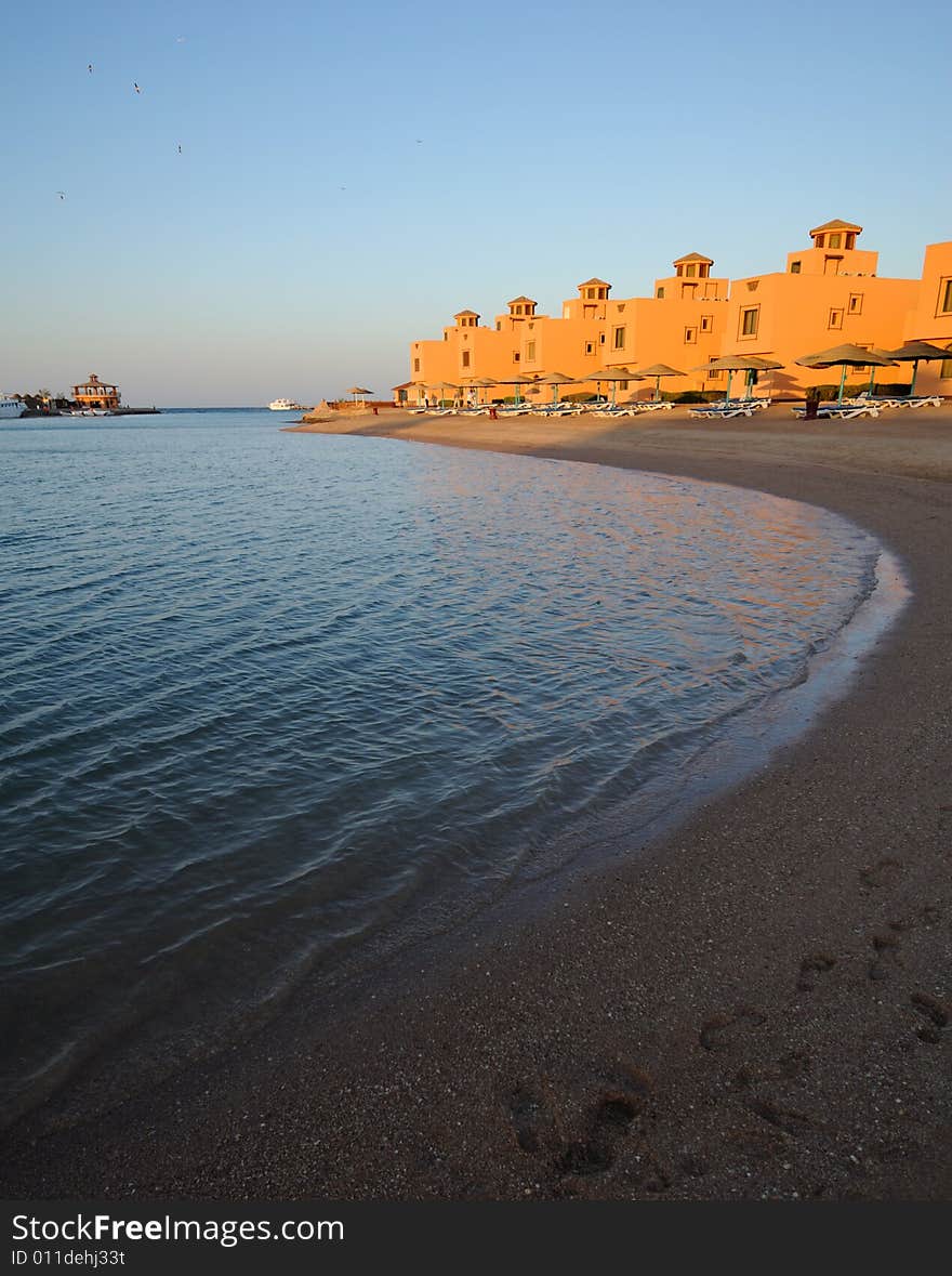 Sunset view of beachfront hotel