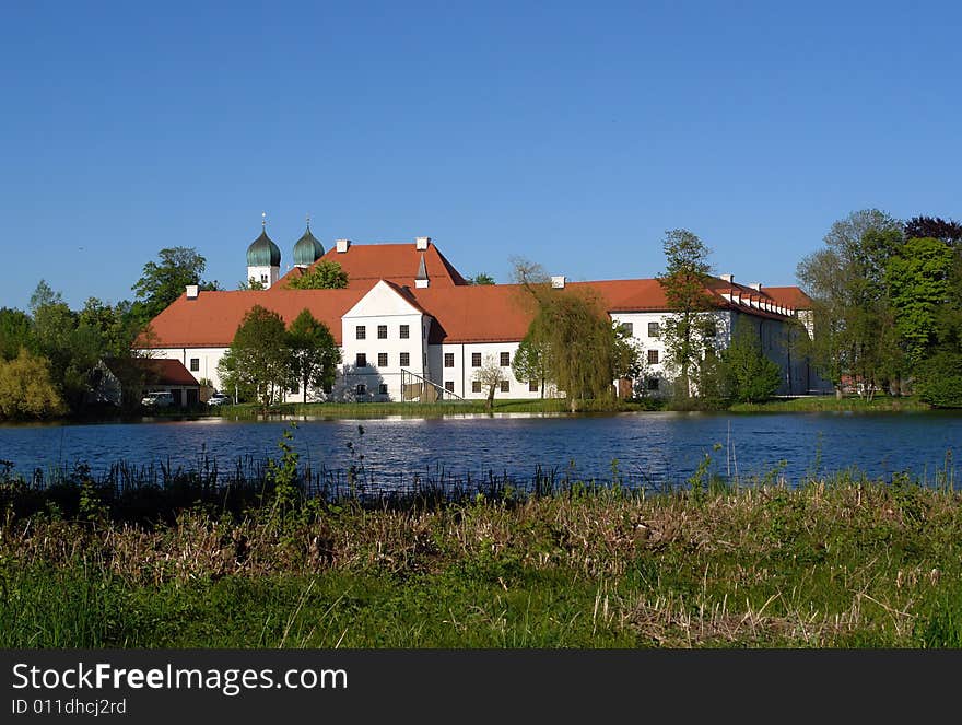 Old Monastery with Church on Seeon lake in  South Bavaria .  Not so far from Traunstein City and Chiemsee lake. Old Monastery with Church on Seeon lake in  South Bavaria .  Not so far from Traunstein City and Chiemsee lake.