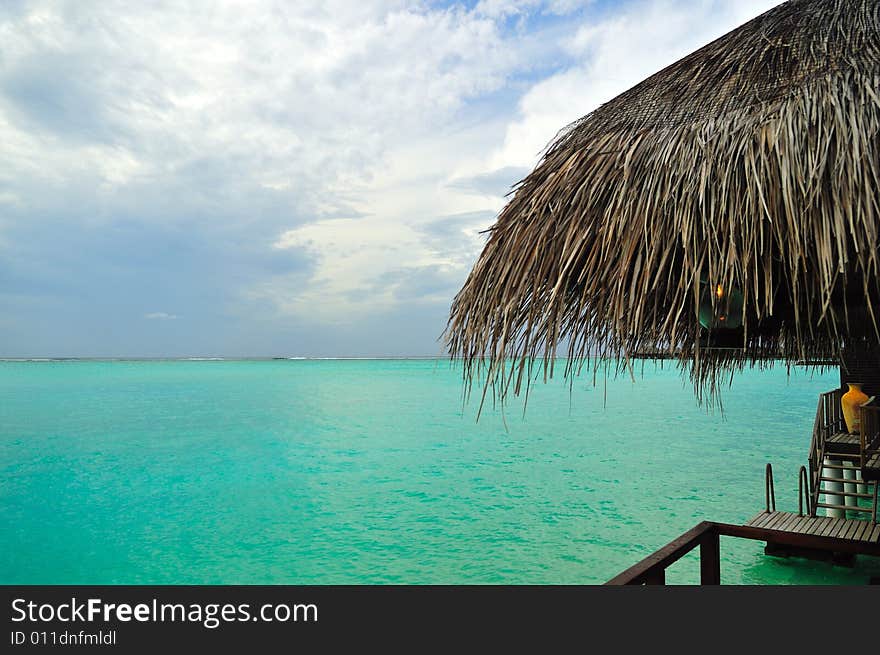 Island of Paradise. White sand beaches with coco-tree and crystal blue water. Maldives. Luxury holidays. Island of Paradise. White sand beaches with coco-tree and crystal blue water. Maldives. Luxury holidays.