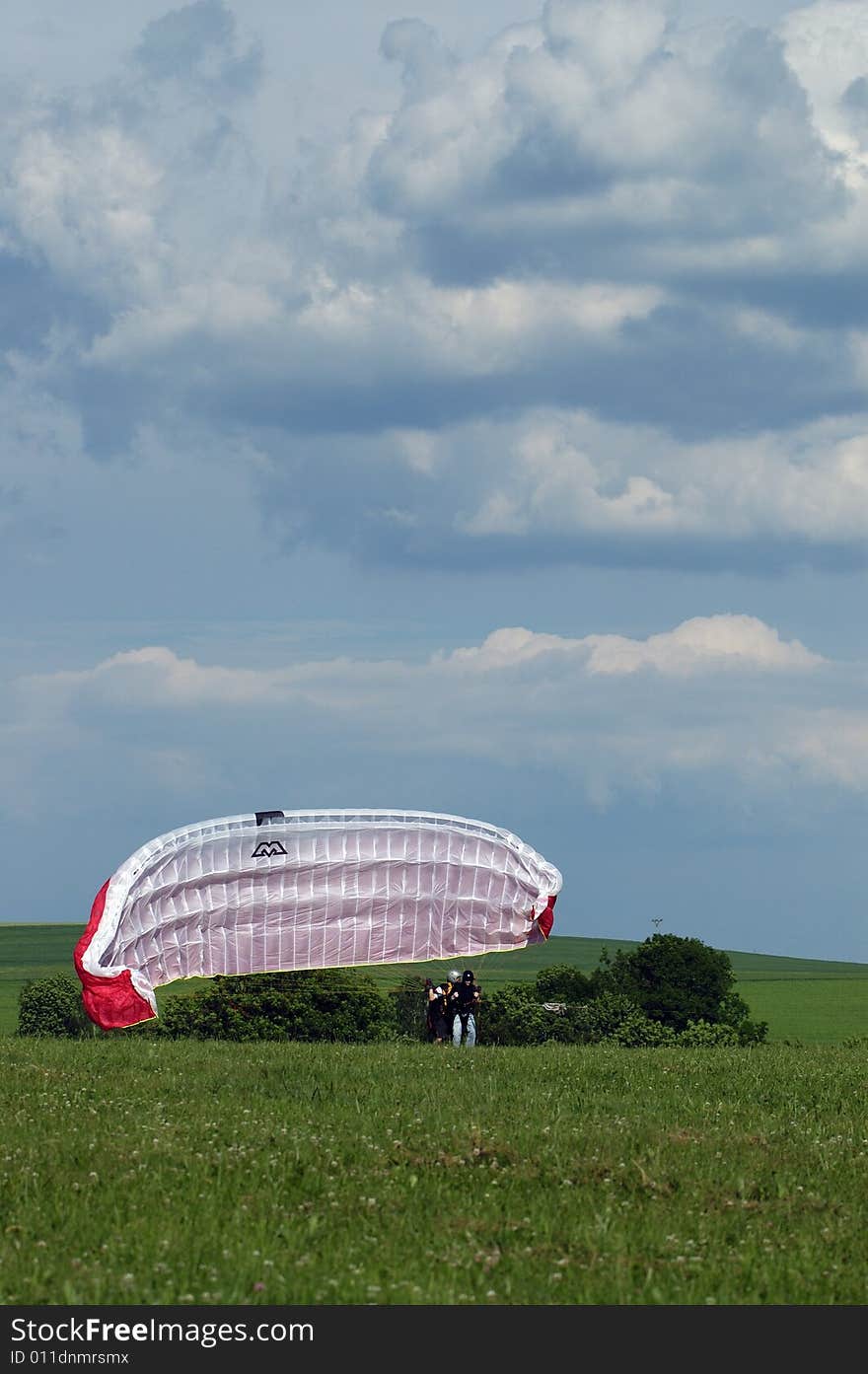 Tandem paragliding in cloudscape area