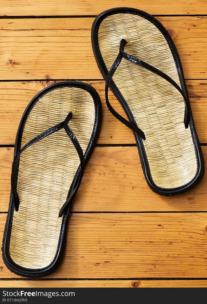 Sandals on wooden floor