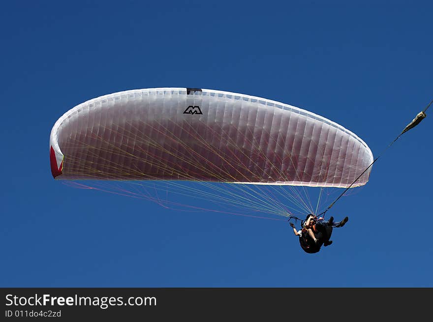 Tandem paragliding in cloudscape area