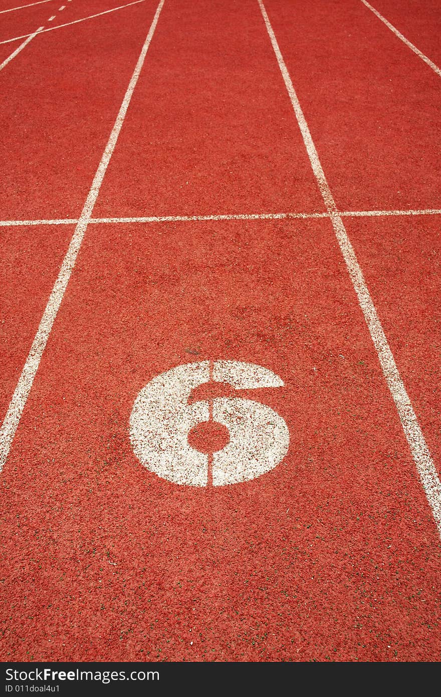 6 on a running track start line. 6 on a running track start line