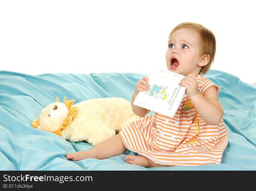 Cute toddler holding a book up to be read to. Cute toddler holding a book up to be read to