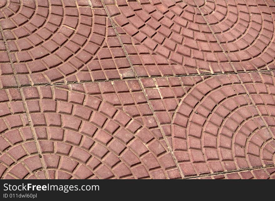 Close-up of new old-style pavement of stoneblocks (bricks) of red color