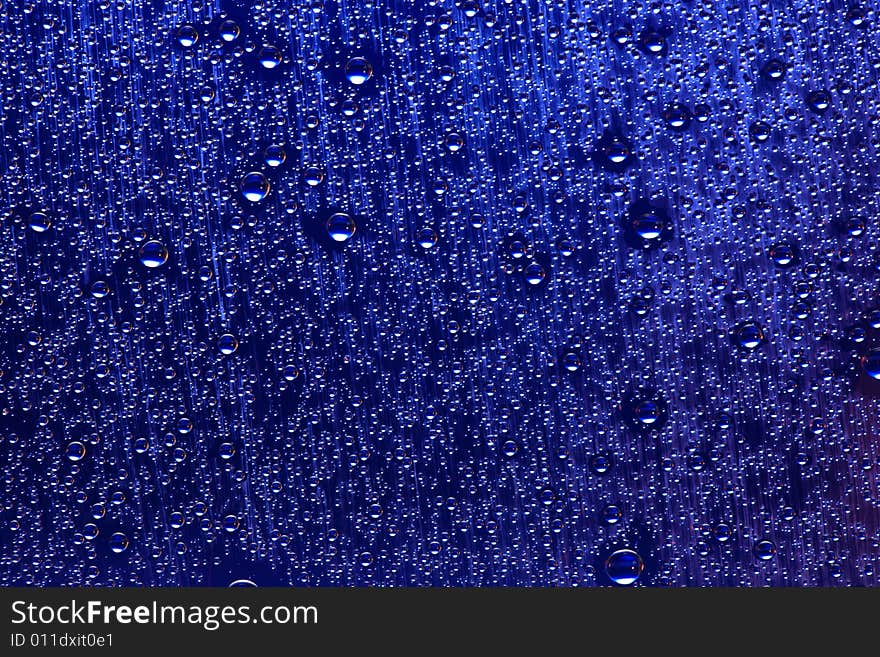 Drops of water on a blue background. Drops of water on a blue background.