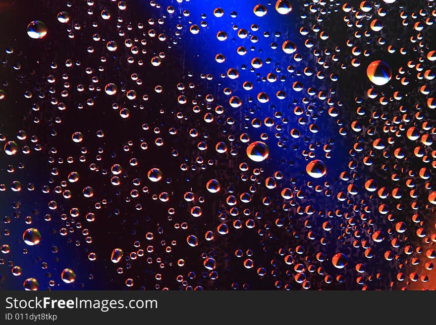 Drops of water on a blue background. Drops of water on a blue background.