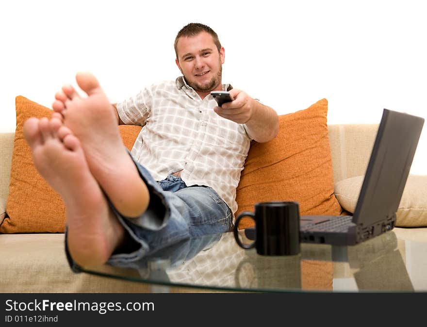 Happy man on sofa with laptop. Happy man on sofa with laptop