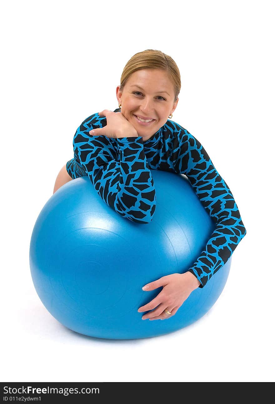 Girl leaning on a gym ball, smiling. Girl leaning on a gym ball, smiling