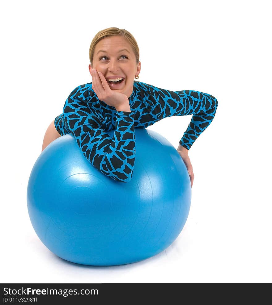 Girl leaning on a gym ball, smiling. Girl leaning on a gym ball, smiling