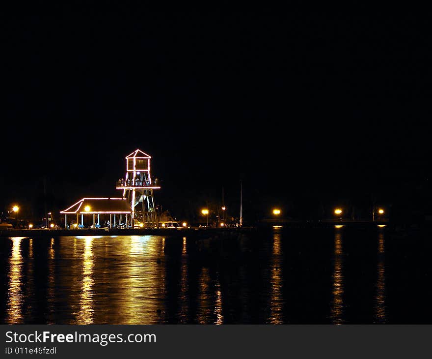 Observatory tower at night on Memphremagog Lake in Magog, Province of Quebec, Canada. Observatory tower at night on Memphremagog Lake in Magog, Province of Quebec, Canada