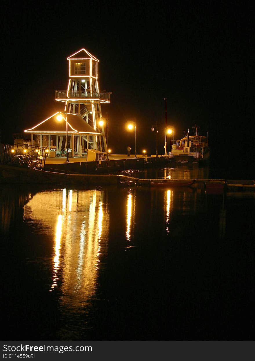 Observatory tower at night on Memphremagog Lake in Magog, Province of Quebec, Canada. Observatory tower at night on Memphremagog Lake in Magog, Province of Quebec, Canada