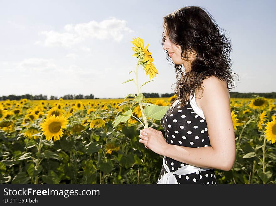 Girl in field with sunflower