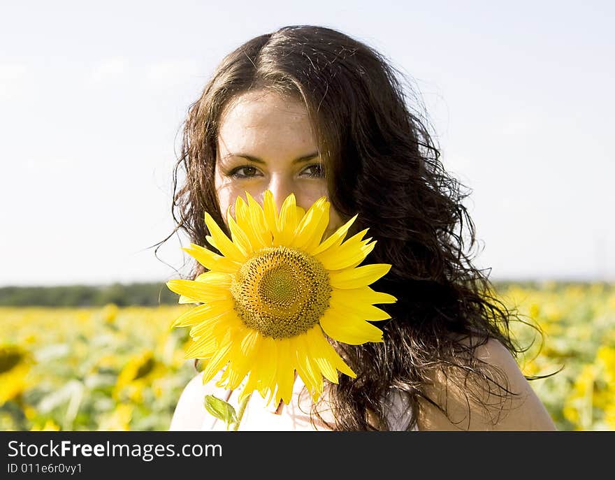 Portrait of young girl with sunflower