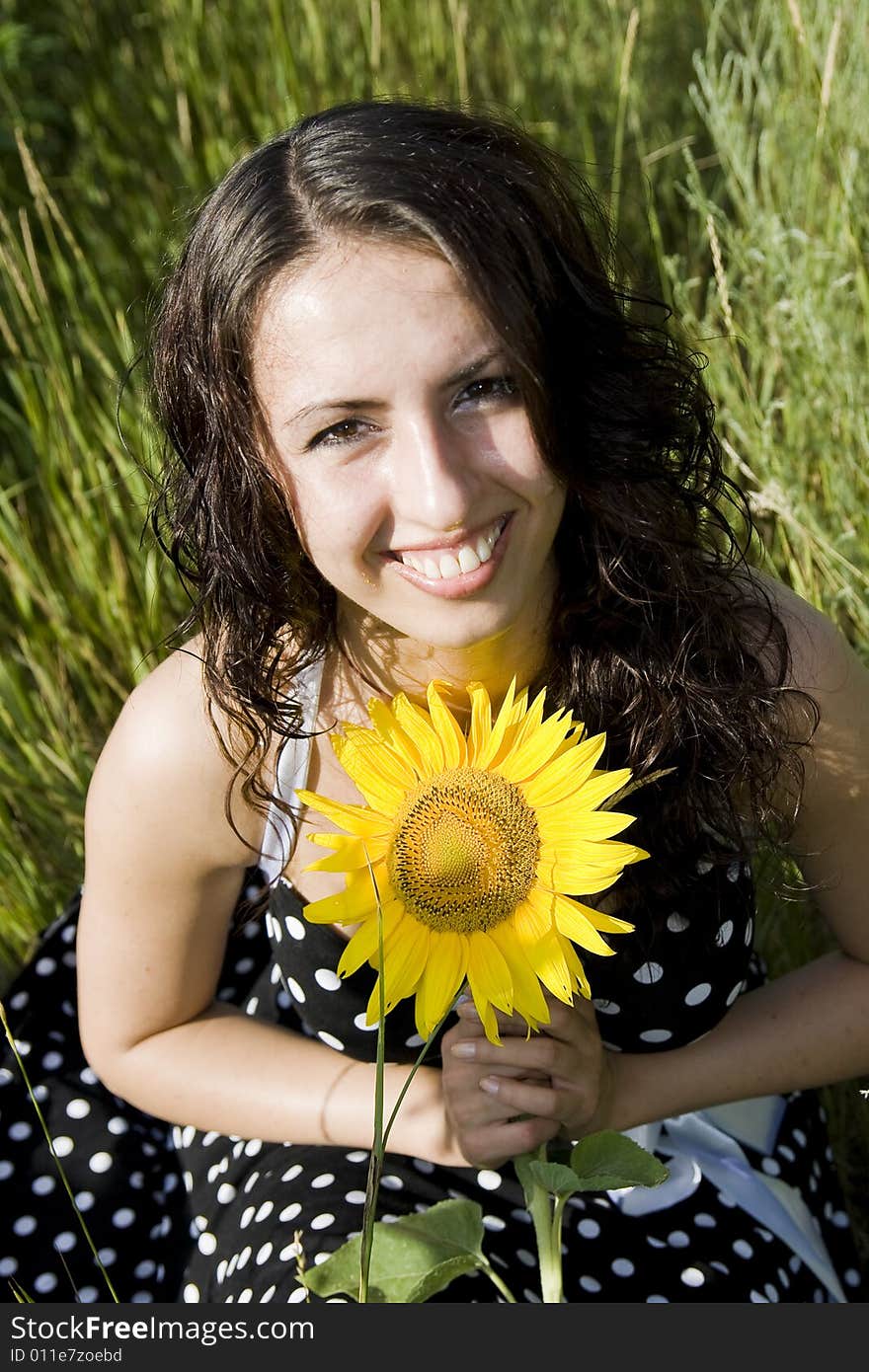 Portrait of smiling girl with sunflower