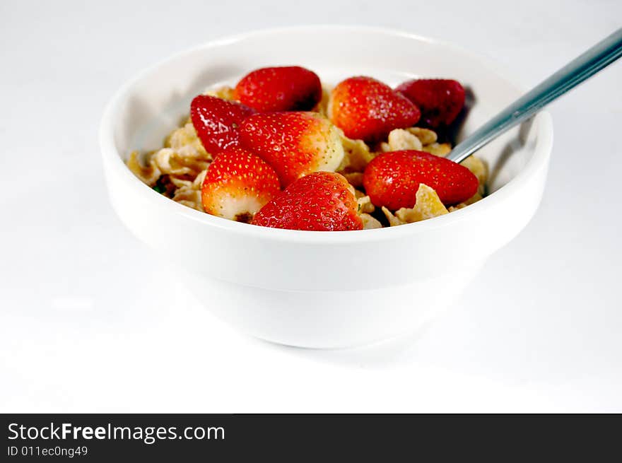 Cereal bowl with strawberries isolated on a white background. Cereal bowl with strawberries isolated on a white background