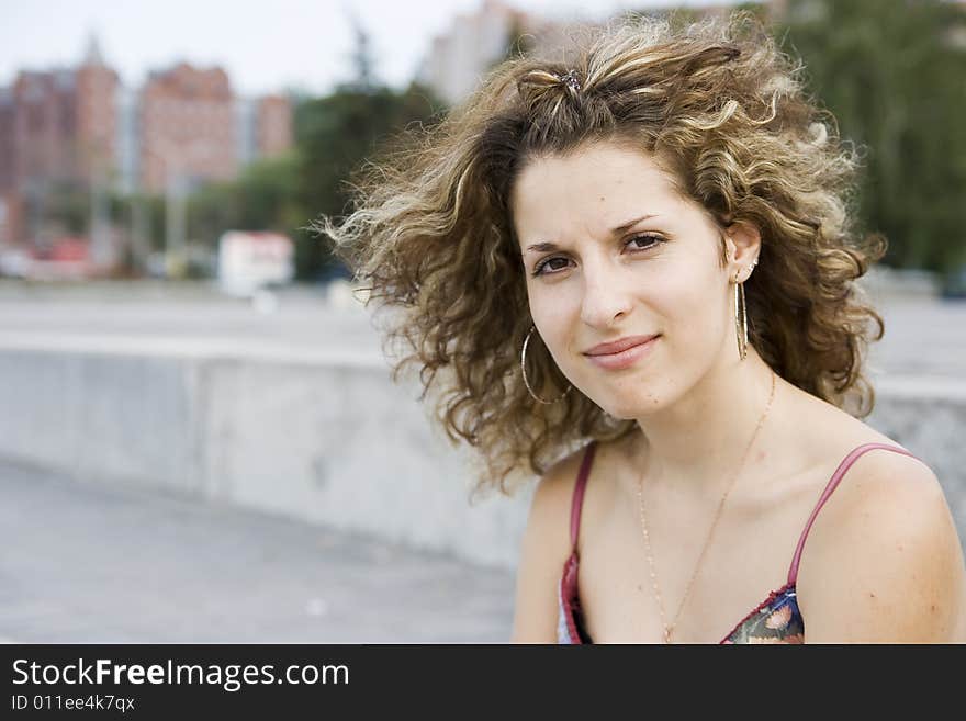 Portrait of smiling girl in city