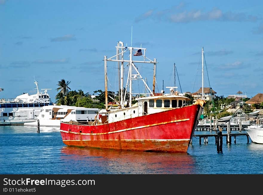 Old red and rust ship resting in the shore. Old red and rust ship resting in the shore