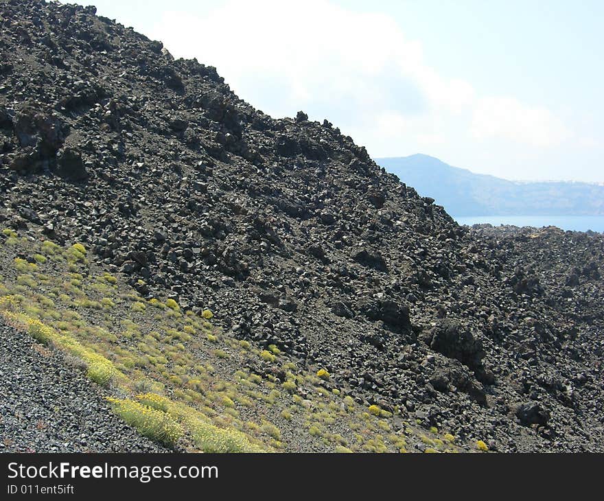 A shot taken from the side of a volcano of the Greek island of Santorini. A shot taken from the side of a volcano of the Greek island of Santorini.