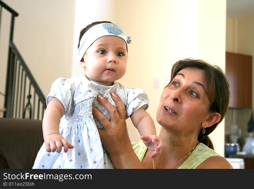 Happy granny and her baby granddaughter. Happy granny and her baby granddaughter.