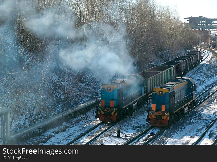 Train and diesel locomotive have a competition in velocities on railway in devil of the city Moscow. Train and diesel locomotive have a competition in velocities on railway in devil of the city Moscow